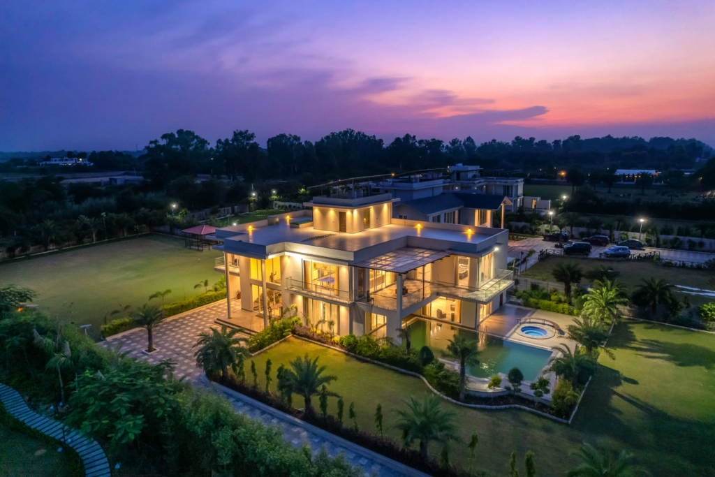 Auric Acres private pool villa near Delhi with infinity pool overlooking greenery