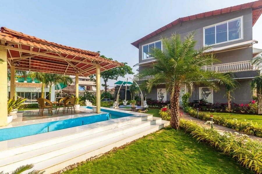 Outdoor swimming pool at family-friendly villa in Lonavala