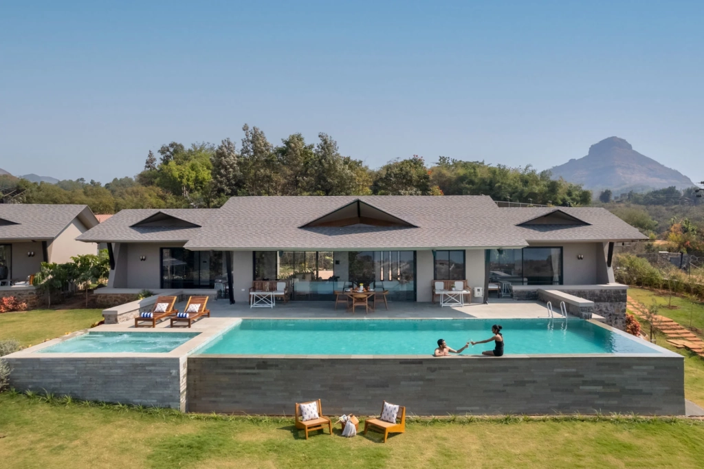 Family enjoying outdoor dining at private villa in Lonavala