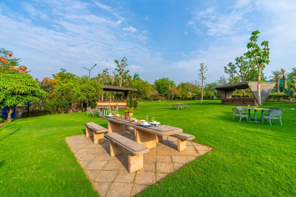 Sunset view over Maple Farms private pool villa near Delhi