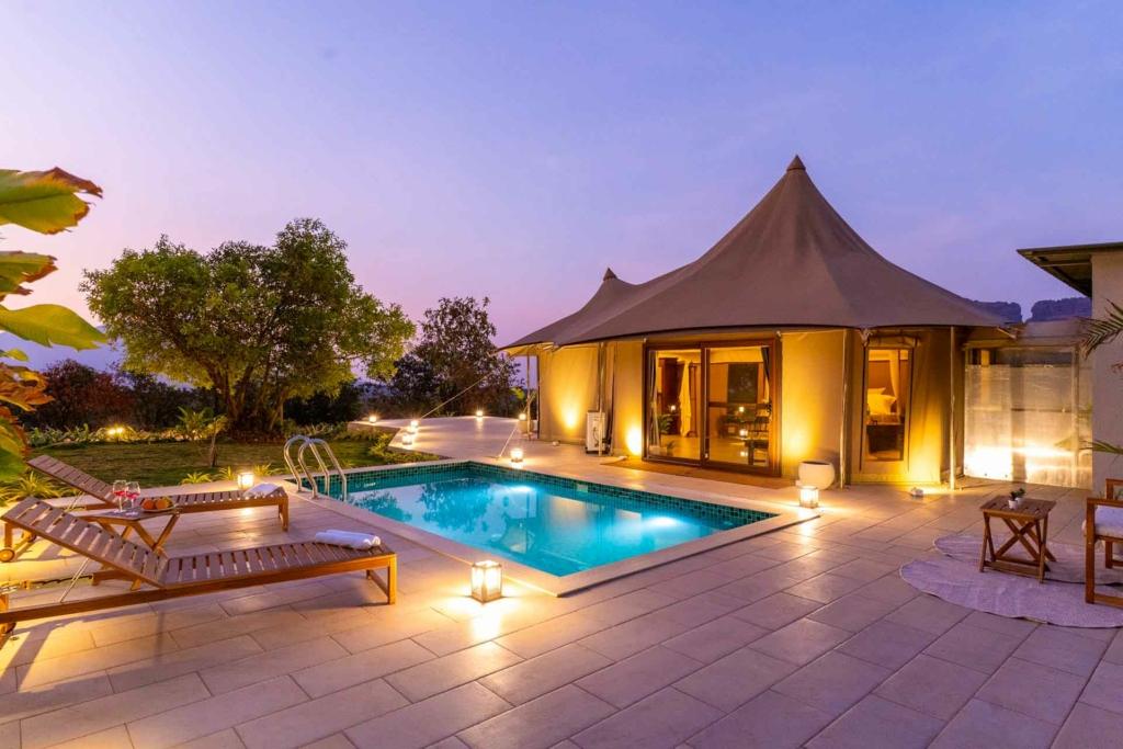 Family enjoying outdoor dining at private villa in Lonavala