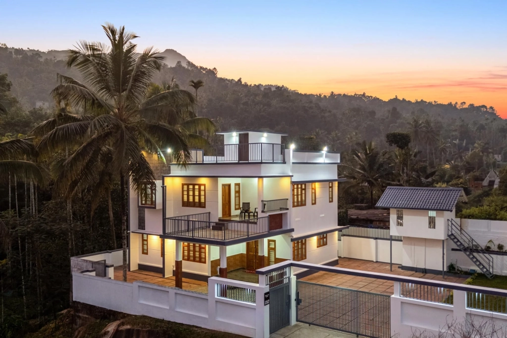Monsoon view of misty hills and homestays in South India