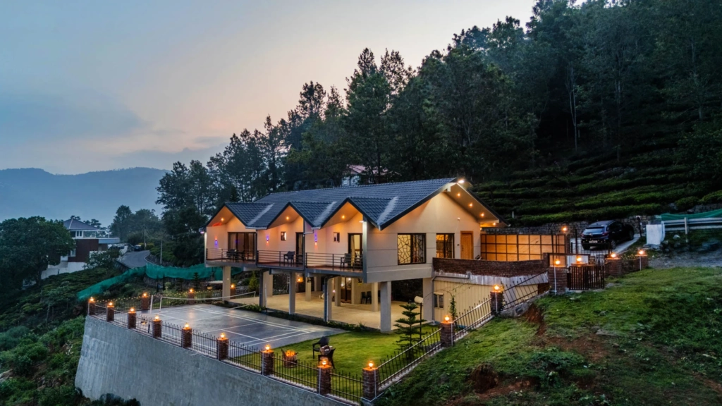 Luxury villa surrounded by greenery during monsoon in South India.