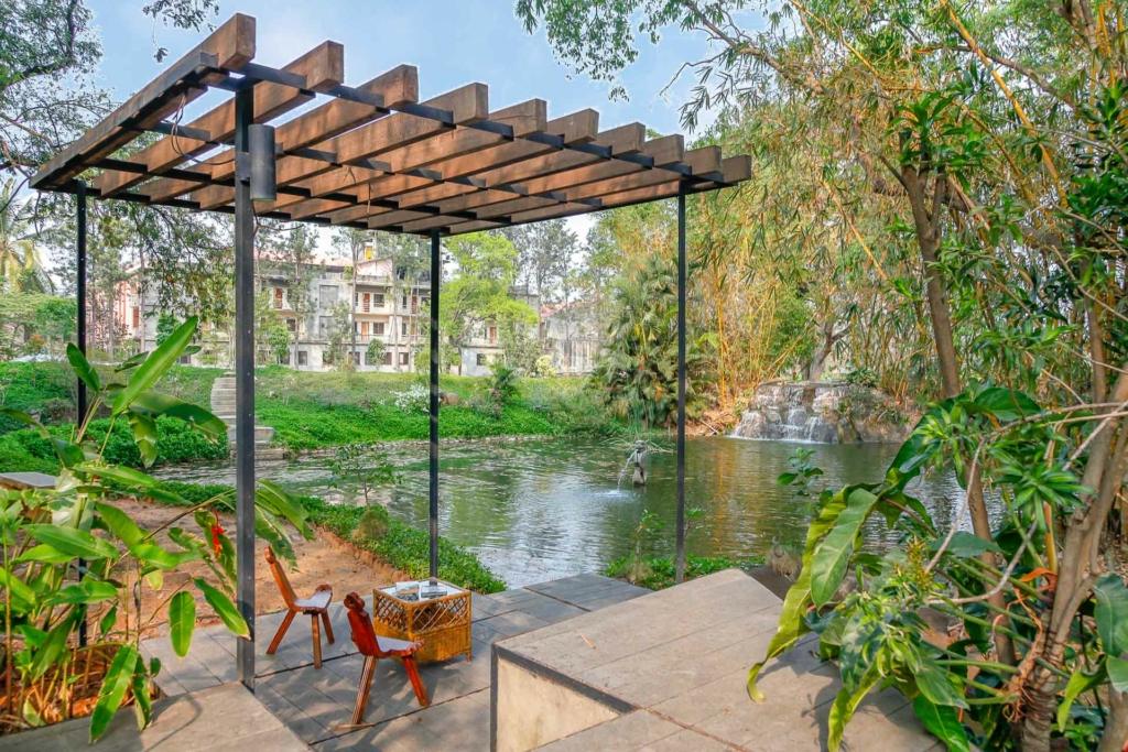 Lawn of a luxury villa set against the backdrop of monsoon treks for kids