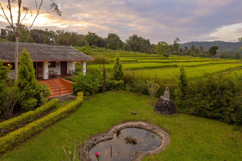 Scenic view of a villa nestled in the hills during monsoon in South India