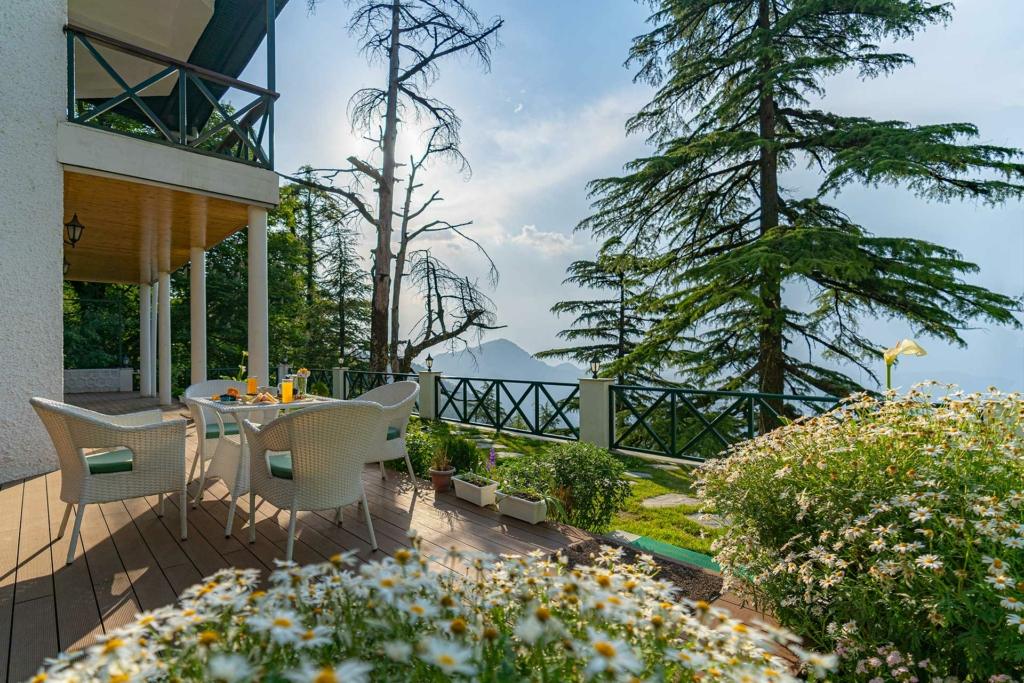 Kids in raincoats ready for monsoon treks for kids outside a scenic villa stay