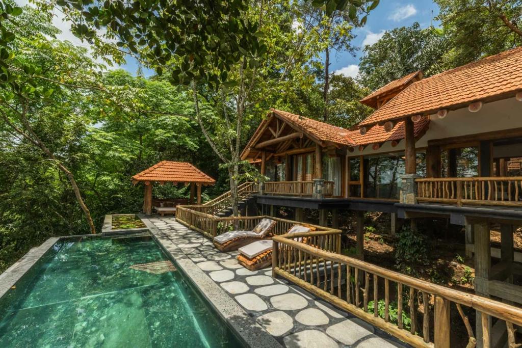 Spacious villa lawn with picnic setup after a day of monsoon treks for kids