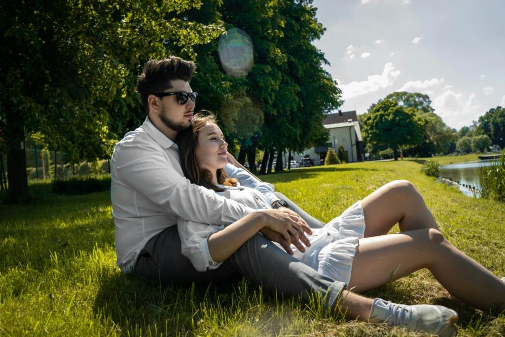 Image credit: konrad-bednarek via unsplash
Couple leaning on a lawn, valentine's day 2026.