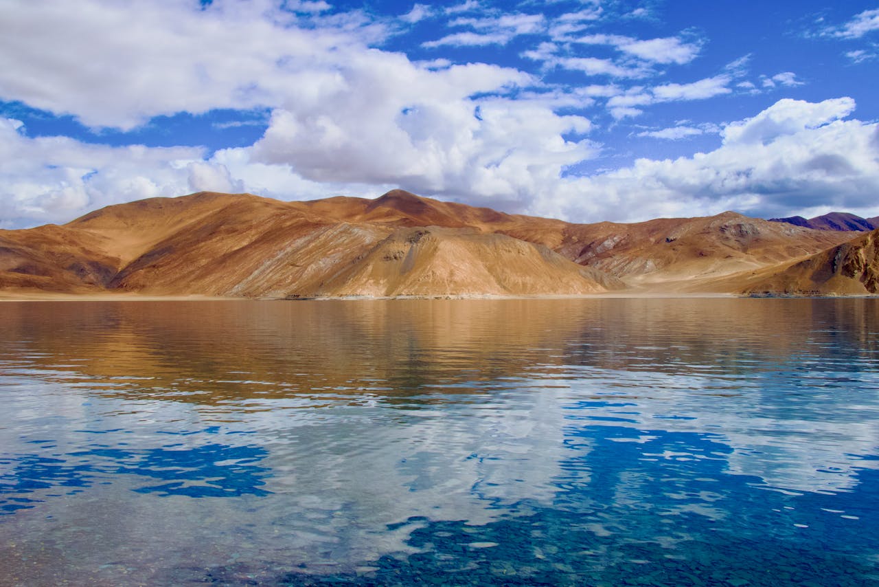 Pangong Lake in Ladakh with blue water and mountains, best places to visit in may in india